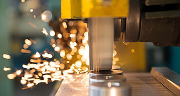 Sparks flying from a parts fabricating machine